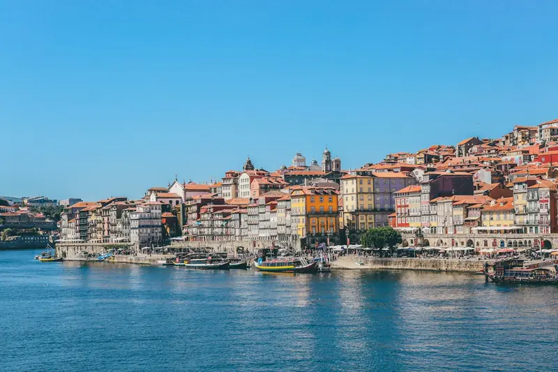 Boats on the Douro River and houses in Porto, Portugal